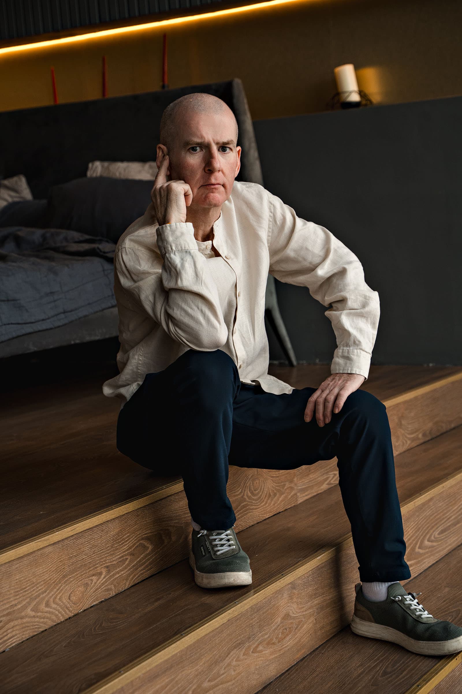 Hugh Mc Enaney — editorial portrait on wooden stairs